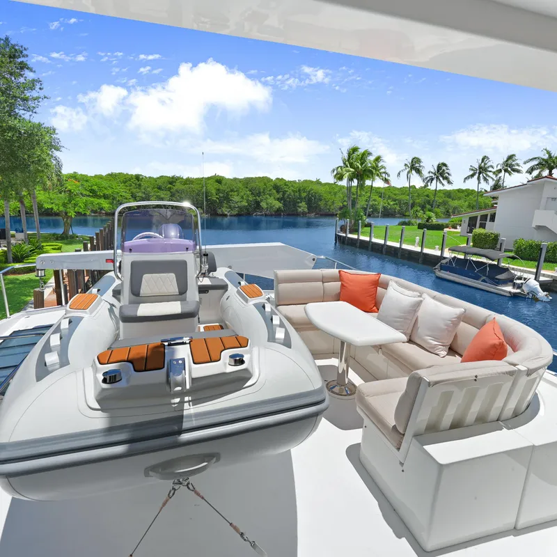 Slide: The Image of Luxurious 2003 Hargrave Sky Lounge yacht deck with seating and scenic waterfront view. - 9