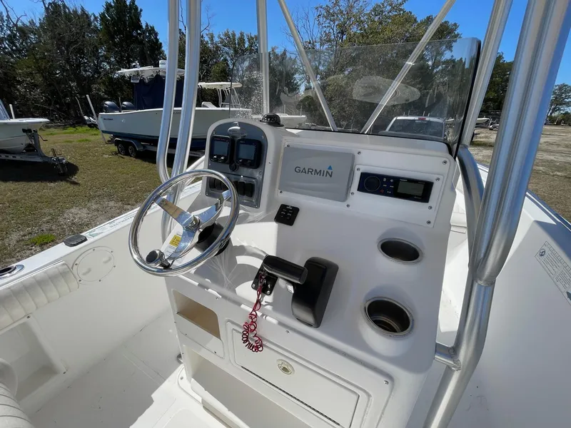 Slide: The Image of 2007 Sea Hunt Triton 207 boat console with Garmin navigation system and steering wheel. - 10