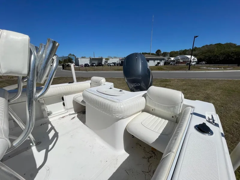 Slide: The Image of 2007 Sea Hunt Triton 207 boat with white seating and Yamaha outboard motor. - 17