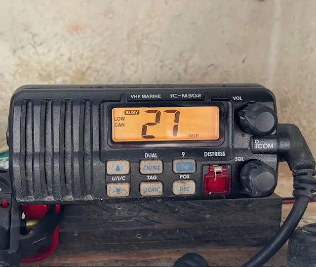 Slide: The Image of VHF marine radio IC-M302 displaying channel 27 on a Sea Hunt Triton 207 boat. - 20