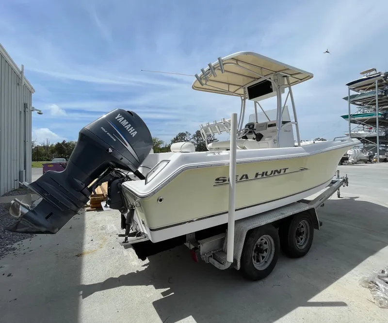 Slide: The Image of 2007 Sea Hunt Triton 207 boat on trailer with Yamaha outboard motor. - 22