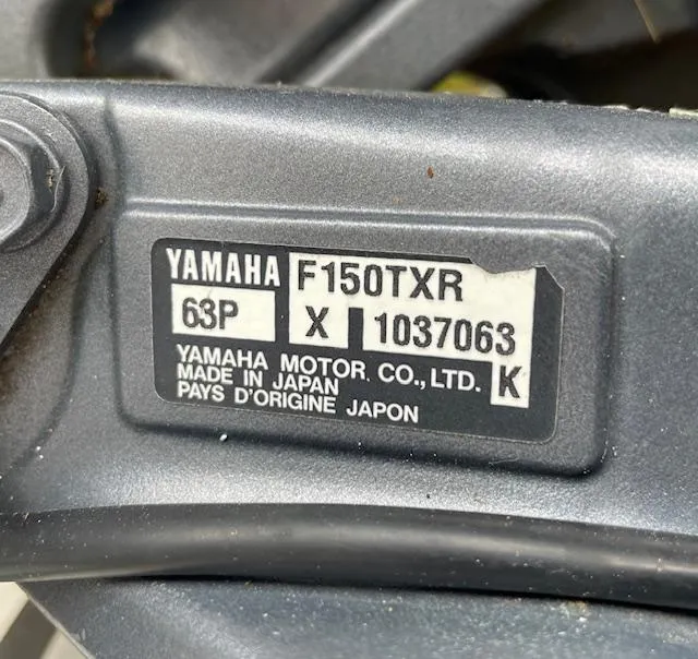 Slide: The Image of Yamaha F150TXR engine label on 2007 Sea Hunt Triton 207, made in Japan. - 27