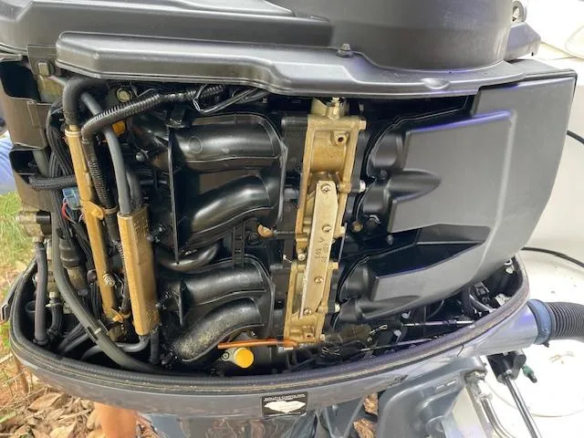 Slide: The Image of 2007 Sea Hunt Triton 207 outboard motor, detailed view of engine components. - 30