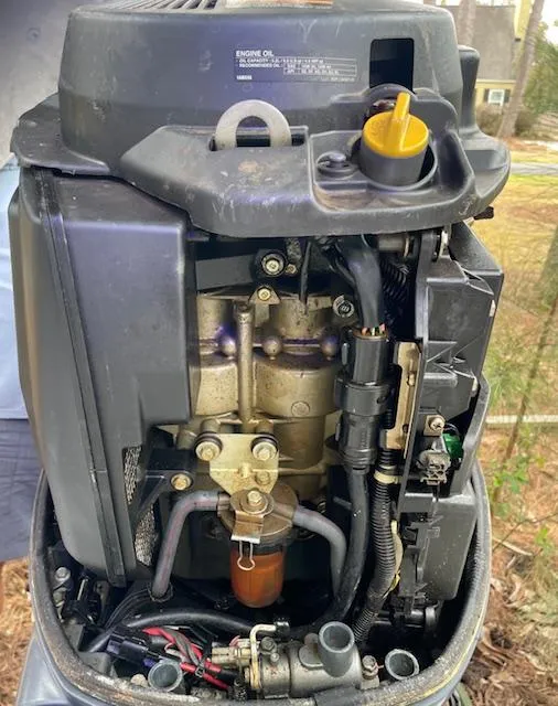 Slide: The Image of Close-up of a 2007 Sea Hunt Triton 207 boat engine, showcasing internal components and wiring. - 31