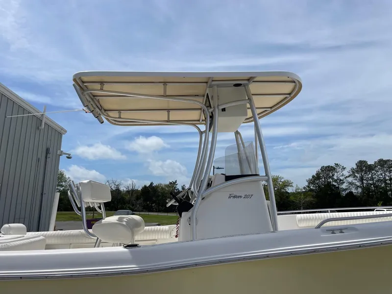 Slide: The Image of 2007 Sea Hunt Triton 207 boat with T-top under a clear blue sky. - 7