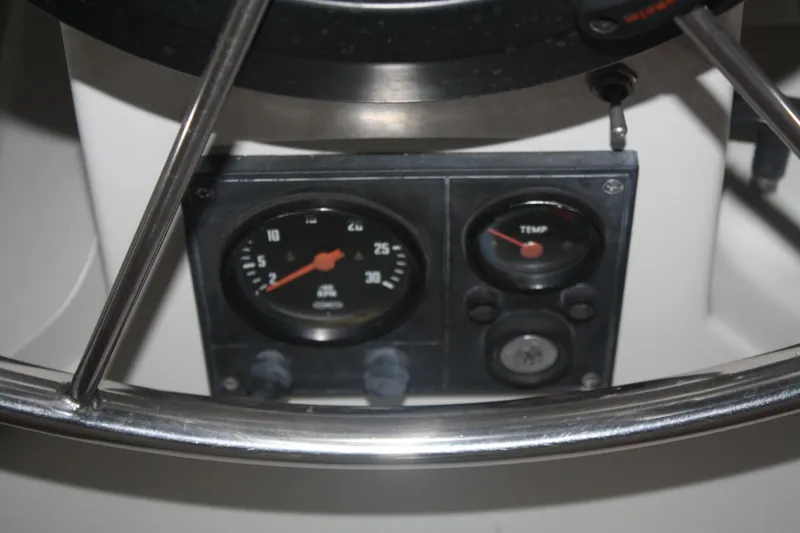 Slide: The Image of 1978 Bombay Clipper Sloop dashboard with gauges and steering wheel. - 40