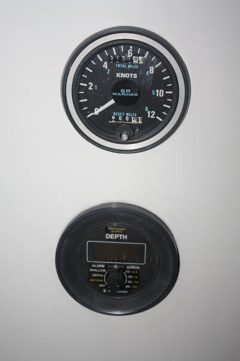 Slide: The Image of 1978 Bombay Clipper Sloop instruments: speedometer in knots and depth gauge. - 44