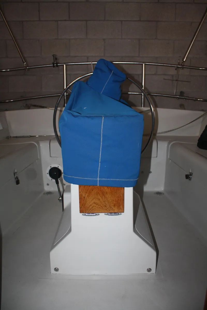 Slide: The Image of 1978 Bombay Clipper Sloop cockpit with blue cover and steering wheel. - 46