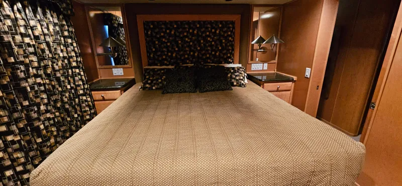 Slide: The Image of Luxurious bedroom interior of 2000 Sumerset Houseboat, featuring a large bed and elegant decor. - 12