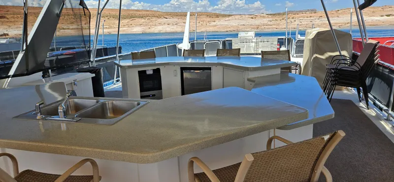 Slide: The Image of Luxurious Sumerset houseboat interior with modern kitchen and scenic water view. - 16