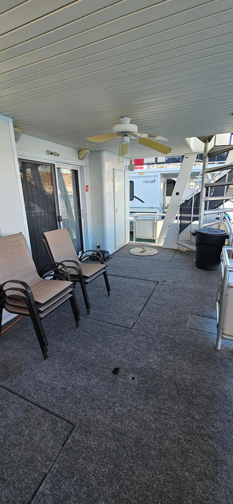 Slide: The Image of 2000 Sumerset Houseboat 21' x 75' deck with chairs and ceiling fan. - 19