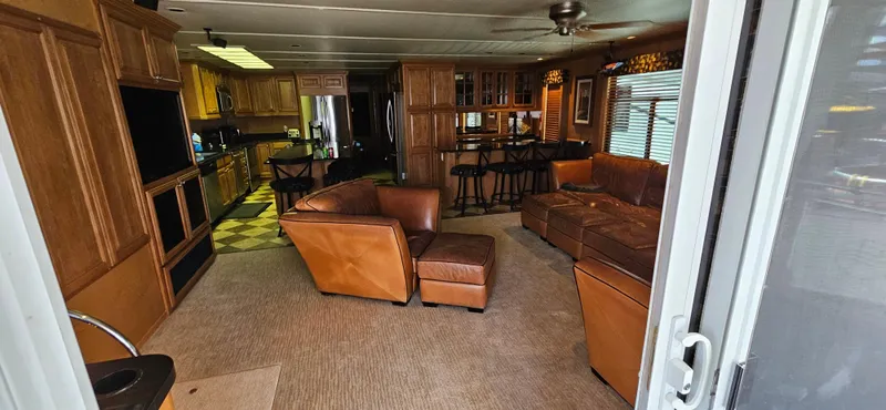 Slide: The Image of Luxurious 2000 Sumerset houseboat interior with leather seating and modern kitchen. - 2