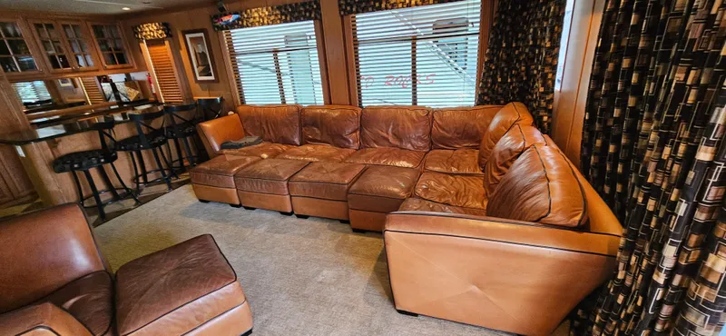 Slide: The Image of Luxurious leather seating in a 2000 Sumerset Houseboat interior, featuring a spacious lounge area. - 3