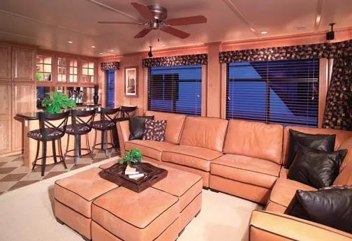 Slide: The Image of Luxurious Sumerset houseboat interior with leather seating, bar area, and modern decor. - 7