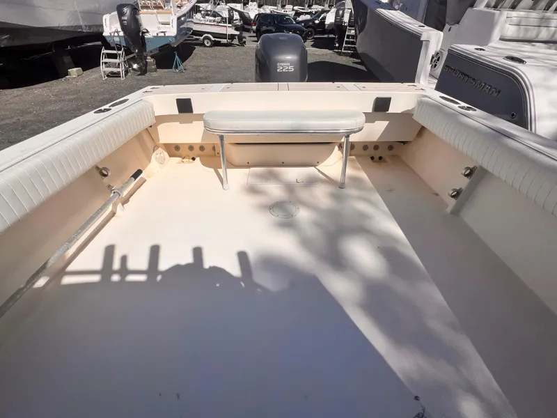 Slide: The Image of 2006 Parker 2320 SL Sport Cabin boat deck with seating and Yamaha 225 engine. - 5