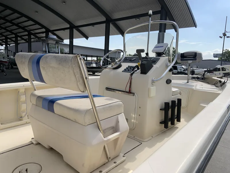 Slide: The Image of 2003 Sea Chaser 190 Bay boat interior with steering console and seating. - 14