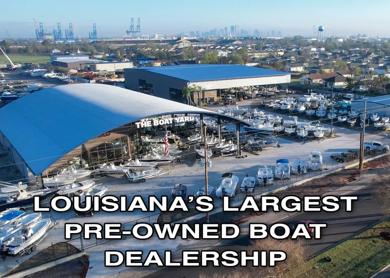 Slide: The Image of Aerial view of Louisiana's largest pre-owned boat dealership, featuring numerous boats. - 15
