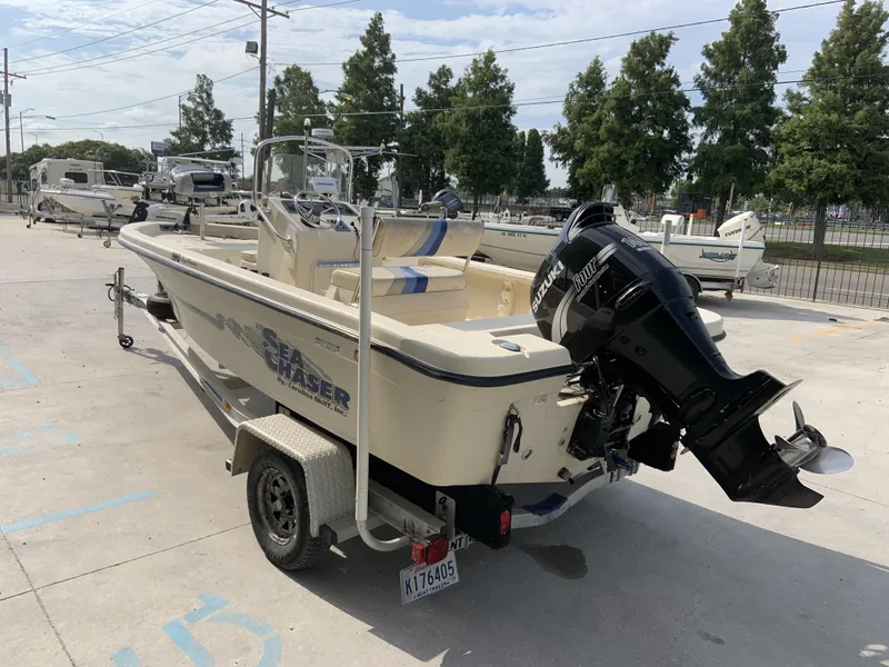 Slide: The Image of 2003 Sea Chaser 190 Bay boat with Suzuki outboard motor on trailer. - 21