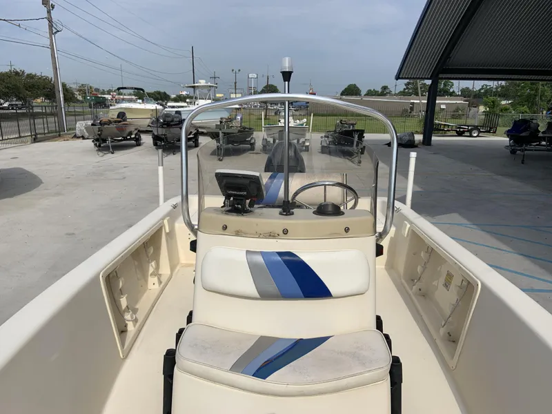 Slide: The Image of 2003 Sea Chaser 190 Bay boat interior with steering console and seating. - 6