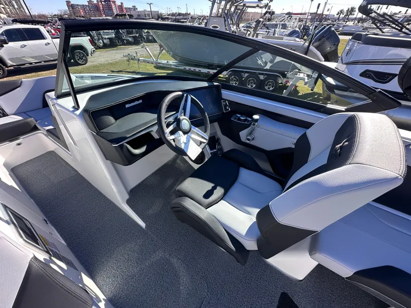 Slide: The Image of 2025 MasterCraft X24 boat interior with modern steering and seating. - 10