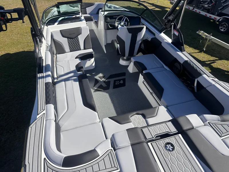 Slide: The Image of 2025 MasterCraft X24 boat interior with sleek seating and modern design. - 14