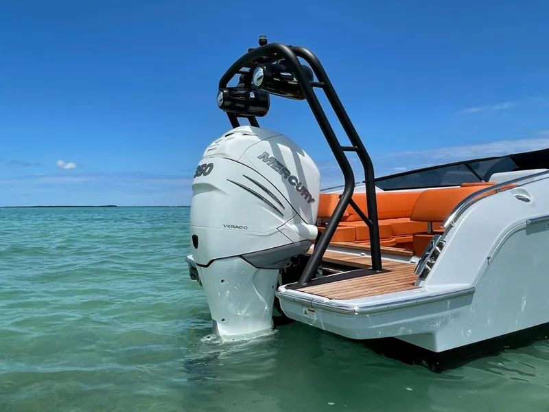 Slide: The Image of 2022 Cranchi 26 Rider boat with Mercury engine in clear blue water. - 17