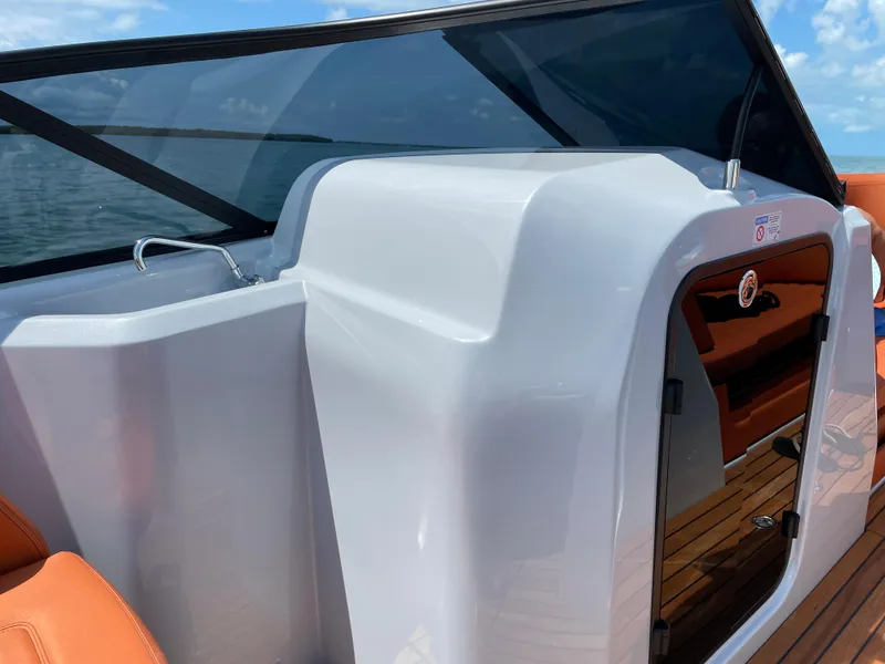 Slide: The Image of 2022 Cranchi 26 Rider boat interior with sleek design and modern features. - 23