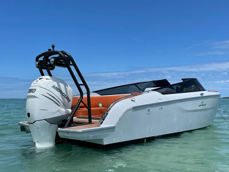 Slide: The Image of 2022 Cranchi 26 Rider boat on clear water under blue sky. - 3