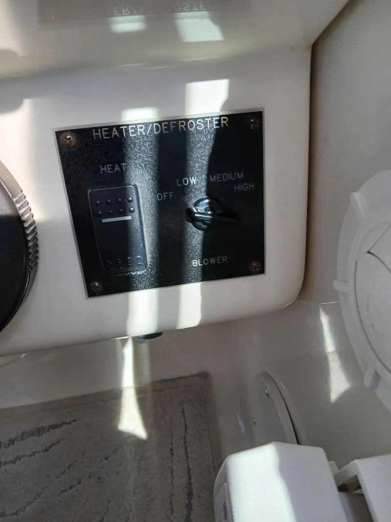 Slide: The Image of Heater/defroster control panel on 1997 Sea Ray 370 Sundancer boat. - 10