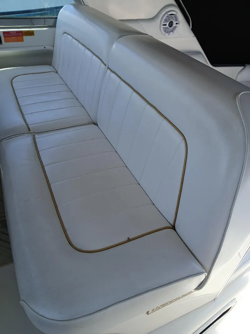 Slide: The Image of White leather seating on a 1997 Sea Ray 370 Sundancer boat. - 13