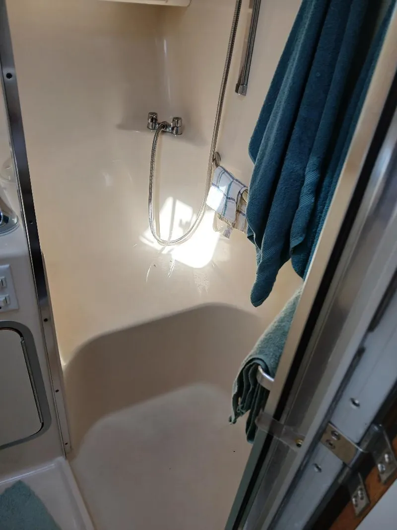 Slide: The Image of Compact kitchen in 1997 Sea Ray 370 Sundancer yacht with stove, microwave, and sink. - 17