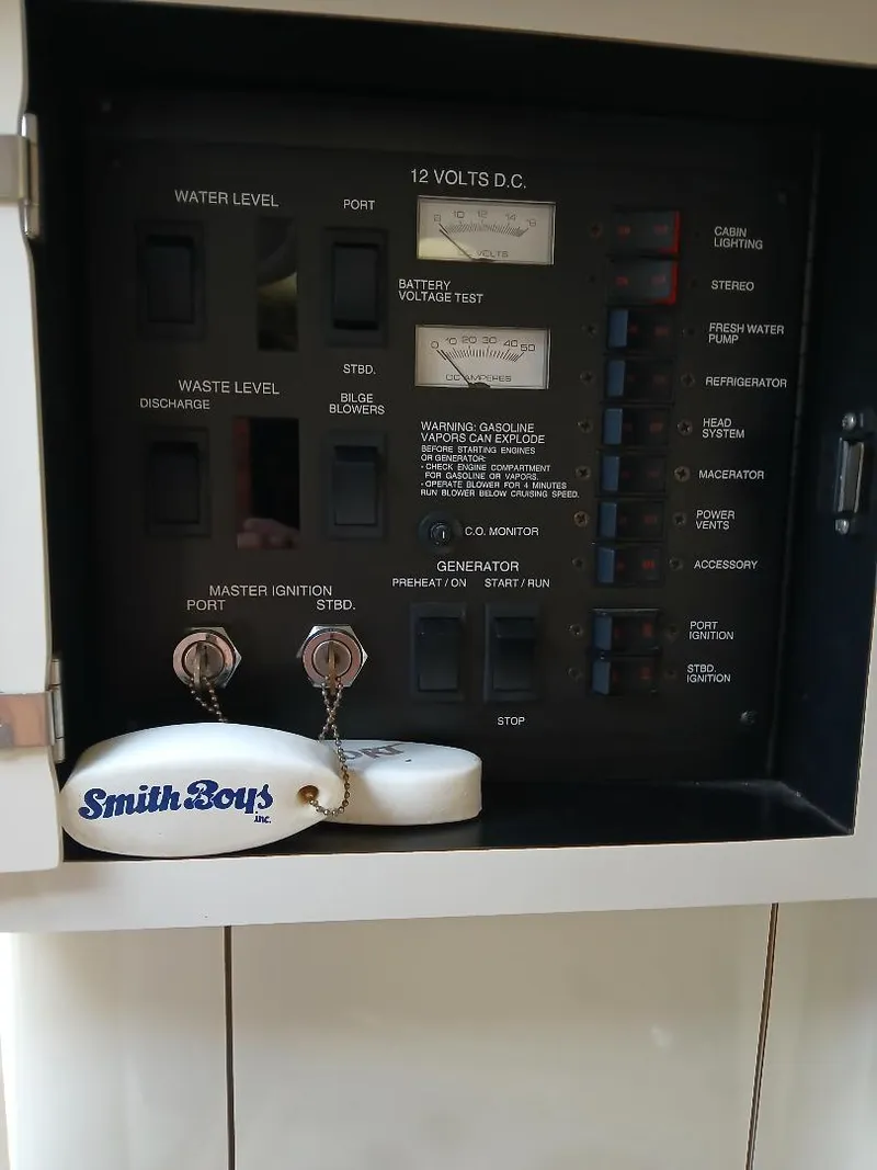 Slide: The Image of 1997 Sea Ray 370 Sundancer bathroom with toilet, sink, and mirror. - 19