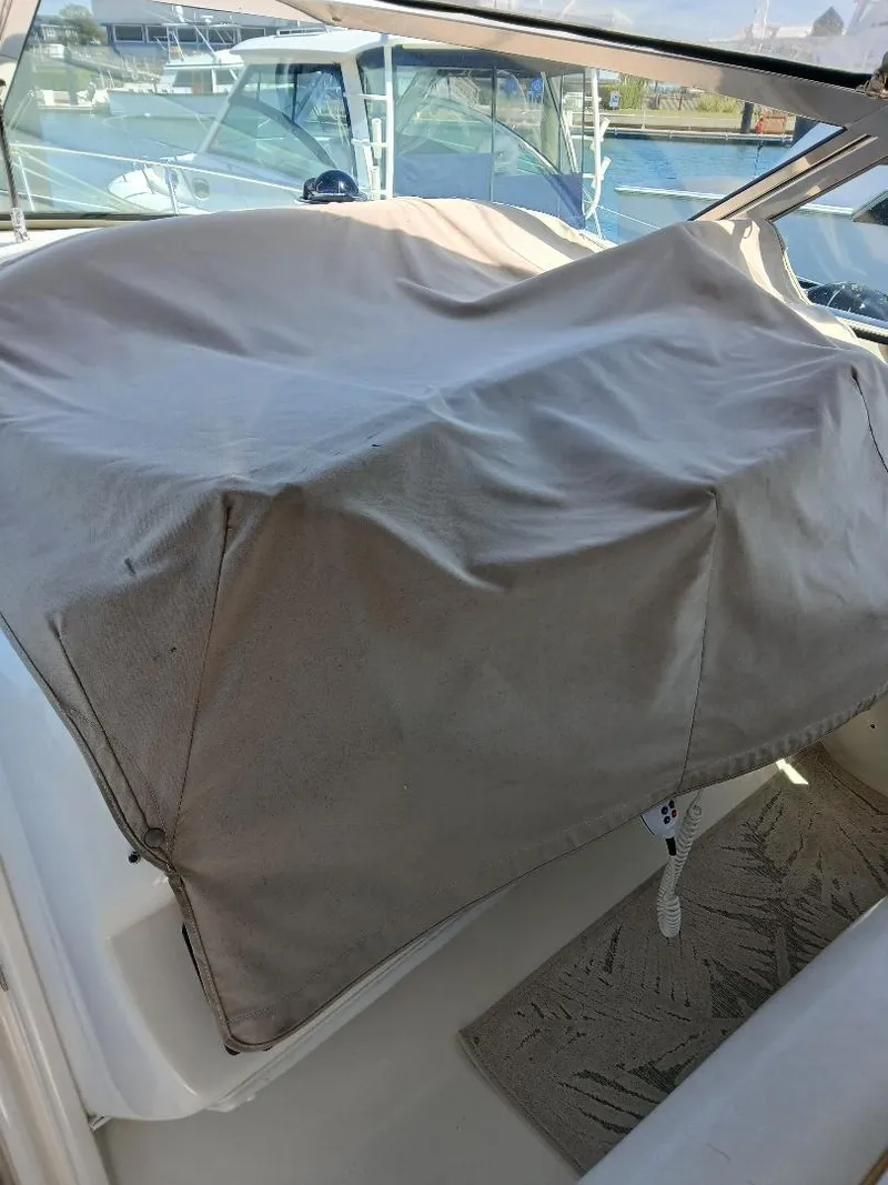 Slide: The Image of 1997 Sea Ray 370 Sundancer interior with covered seating area. - 5