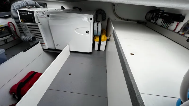 Slide: The Image of Engine room of 2020 Beneteau Swift Trawler 44 with Cummins Onan generator. - 18