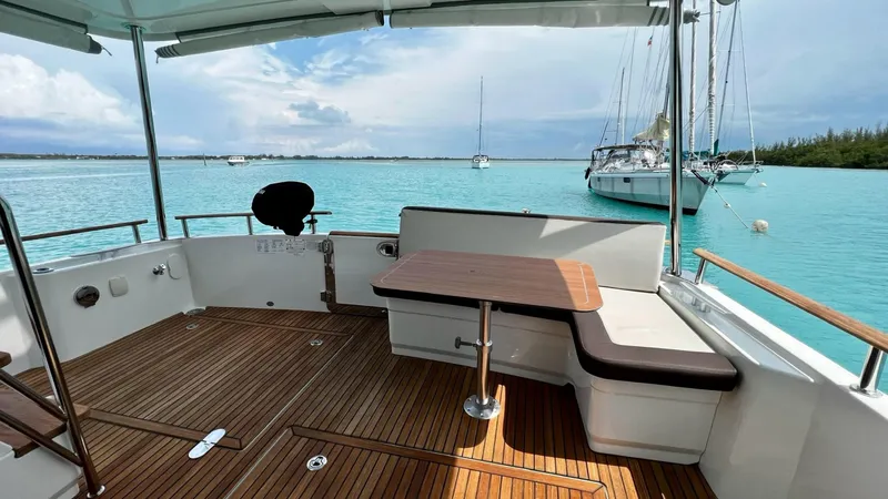 Slide: The Image of Beneteau Swift Trawler 44, 2020 model, featuring a spacious deck with ocean view. - 25