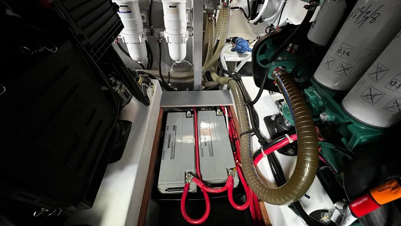 Slide: The Image of Engine room of 2020 Beneteau Swift Trawler 44 with batteries and mechanical components. - 36