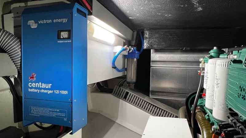 Slide: The Image of Engine room of 2020 Beneteau Swift Trawler 44 with Victron Energy battery charger. - 38