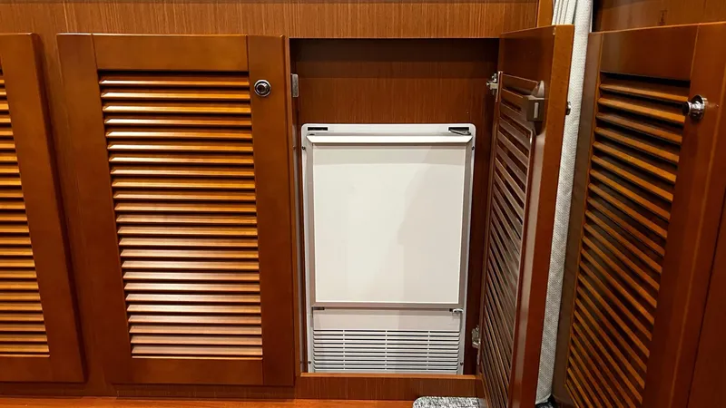 Slide: The Image of Built-in appliance in Beneteau Swift Trawler 44, 2020 model, with wooden cabinet doors. - 43
