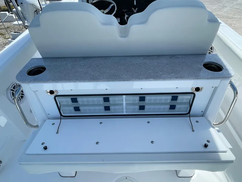 Slide: The Image of 2024 Everglades 285CC boat interior with seating and storage area. - 11