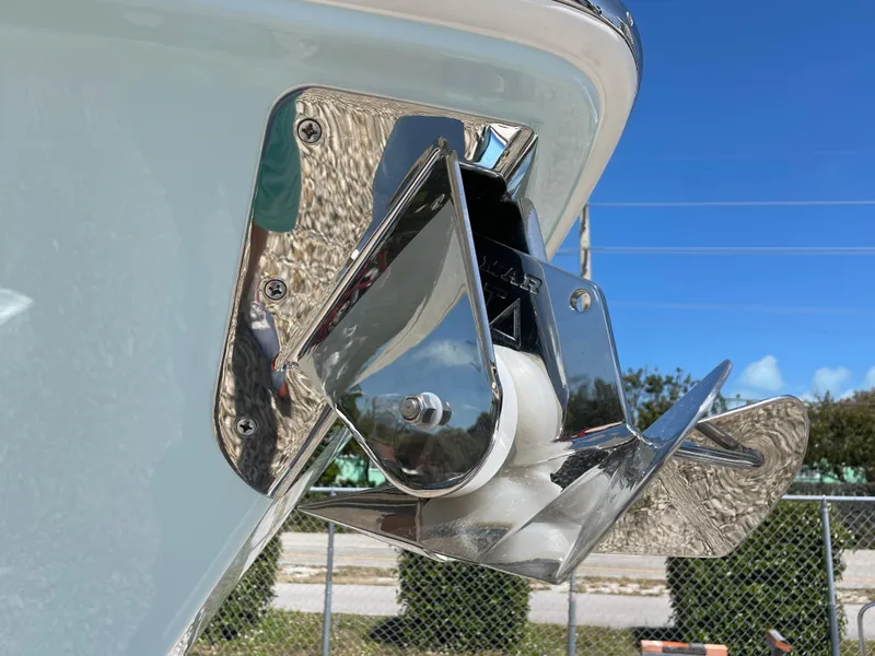 Slide: The Image of 2024 Everglades 285CC boat anchor detail against a clear blue sky. - 2