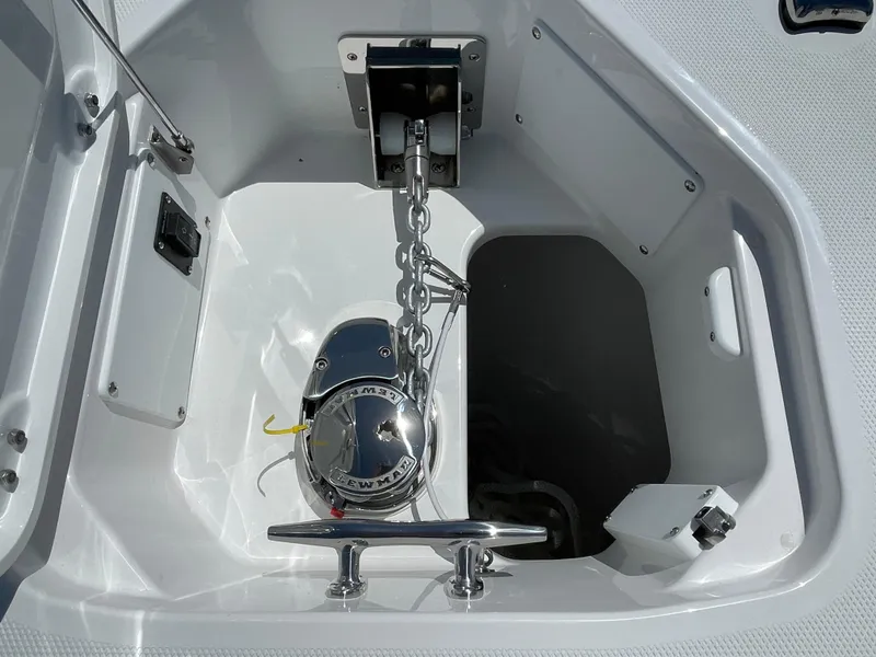 Slide: The Image of Anchor compartment of 2024 Everglades 285CC boat with chain and cleat. - 23