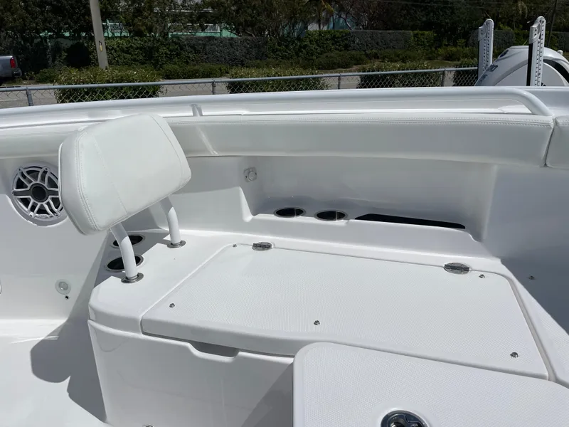 Slide: The Image of 2024 Everglades 285CC boat interior with white seating and speaker detail. - 25
