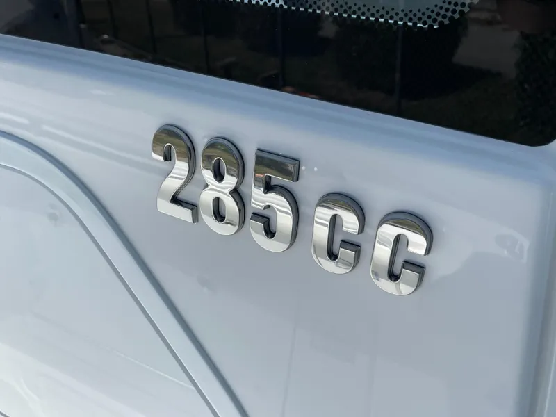 Slide: The Image of Close-up of 2024 Everglades 285CC boat model emblem on white surface. - 29