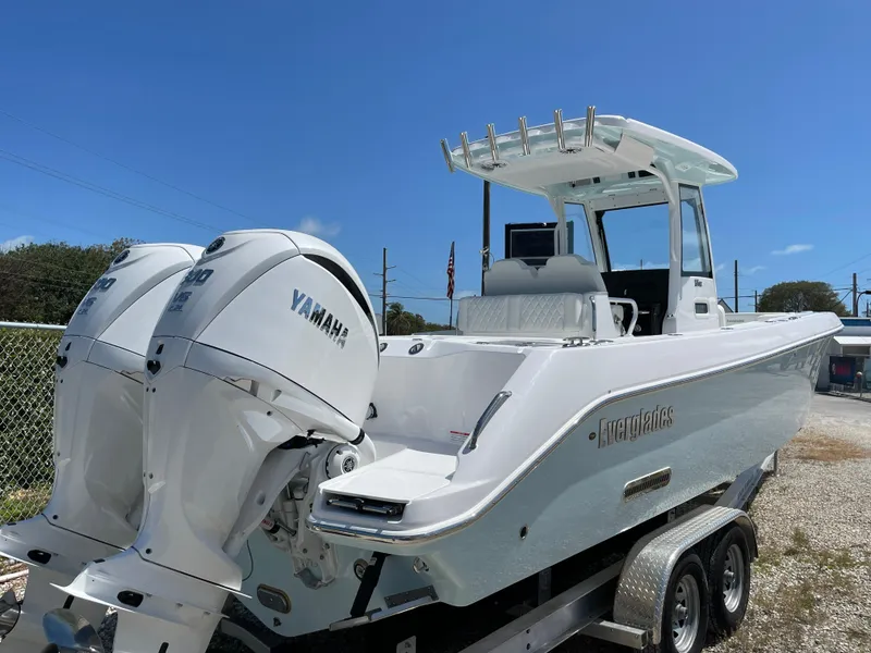 Slide: The Image of 2024 Everglades 285CC boat with dual Yamaha engines on a trailer. - 33