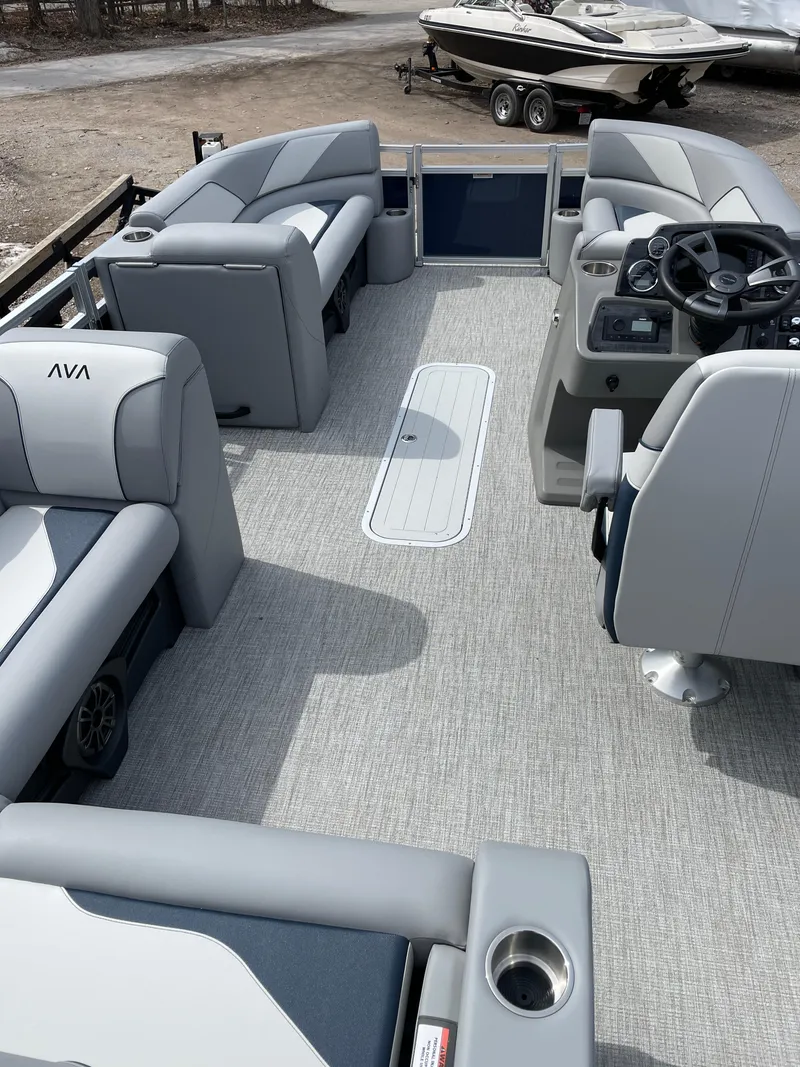 Slide: The Image of 2025 Avalon 23 Venture 85 VRB pontoon boat interior with modern seating and steering console. - 4