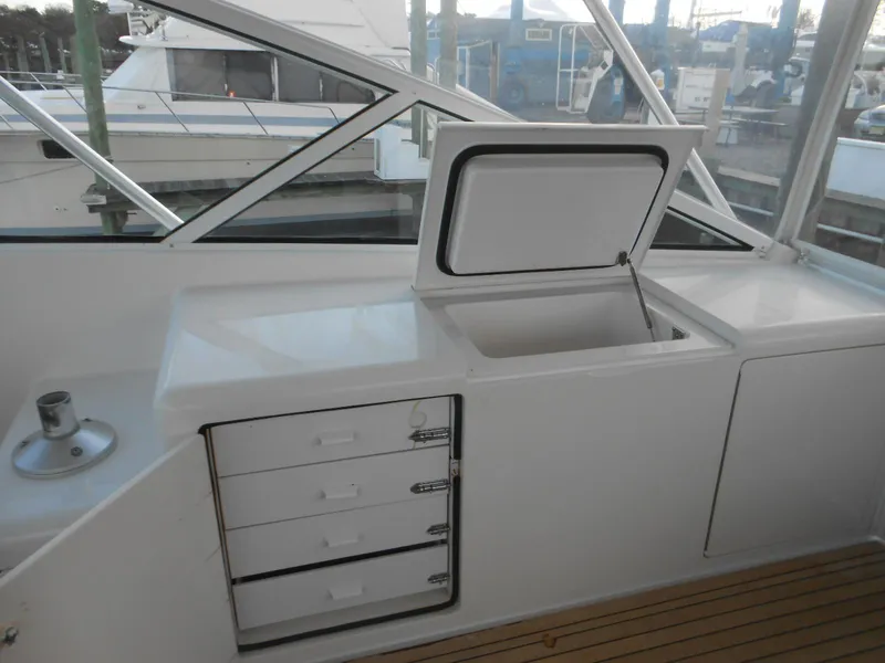 Slide: The Image of 2007 Viking Boats 52 Open interior with storage drawers and open compartment. - 12