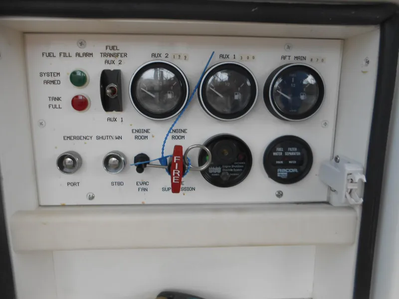 Slide: The Image of Control panel of a 2007 Viking Boats 52 Open, featuring gauges and switches. - 17