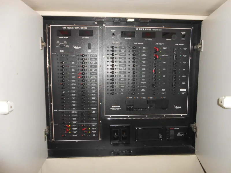 Slide: The Image of Electrical control panel inside a 2007 Viking Boats 52 Open yacht. - 19
