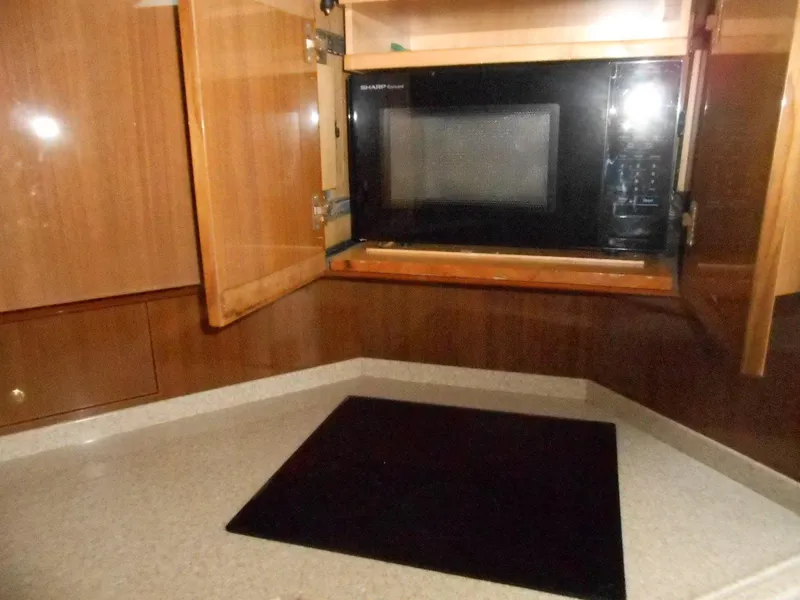 Slide: The Image of 2007 Viking Boats 52 Open kitchen with microwave and stovetop. - 28