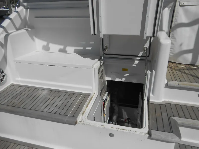Slide: The Image of 2007 Viking Boats 52 Open, open hatch on deck, white and gray interior. - 30